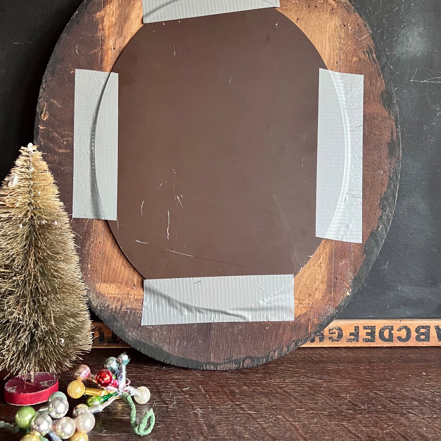 Early Antique Handmade Mirror with Oval Black Frame