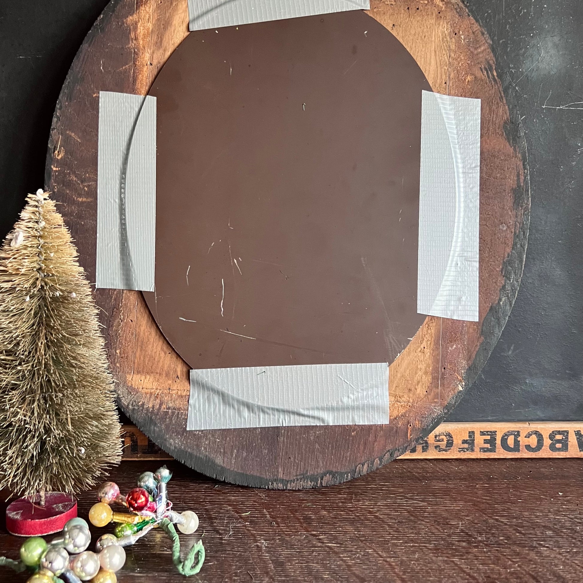 Early Antique Handmade Mirror with Oval Black Frame