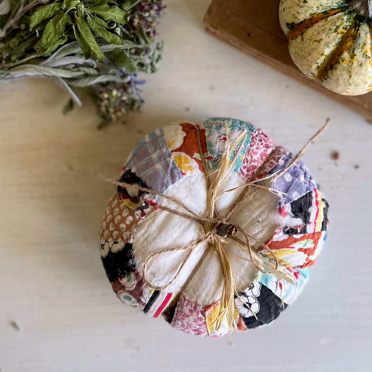 Two Handcrafted Pumpkins Made with Antique Quilts