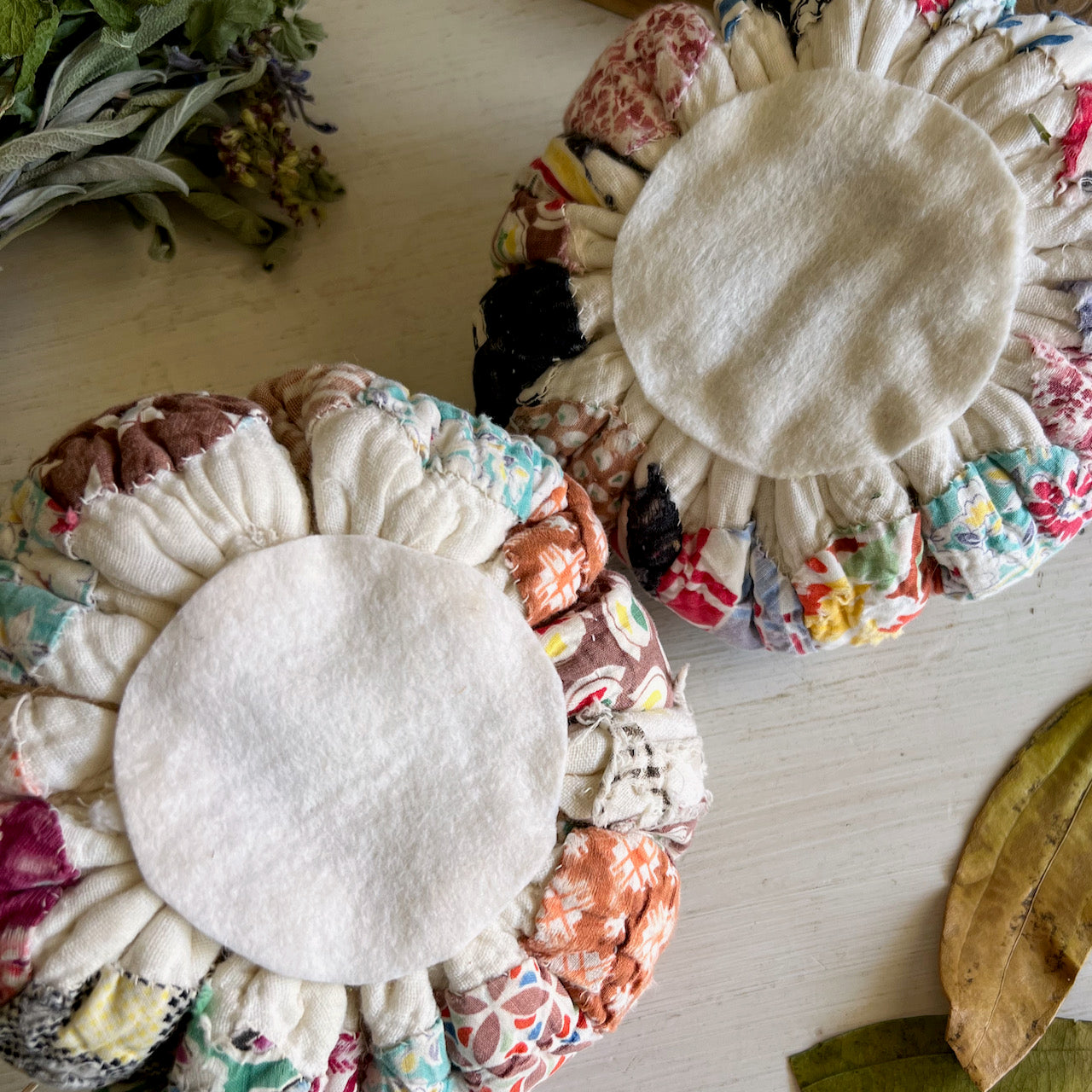 Two Handcrafted Pumpkins Made with Antique Quilts